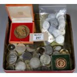 Tin box of mixed coins and tokens, bronze medallion marked Marseille Merieux 1870-1937. In