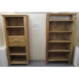 Modern oak narrow display cabinet with fitted drawers, together with a matching oak sideboard and