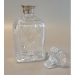 Cut glass mallet shaped decanter and stopper with Danish silver collar and a star cut base. (B.P.