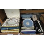 Two boxes of assorted commemorative collectors plates, mugs, etc. to include: Wedgwood Christmas