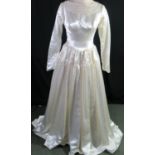 Vintage, possibly 1970s, handmade satin and lace wedding dress with lace neckline adorned with