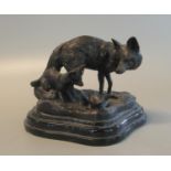 Patinated, probably bronze, study of a vixen and two fox cubs, on ceramic base. 16cm wide approx. (