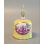 Meissen porcelain canary yellow table bell decorated with reserved puce coloured scenes of moored