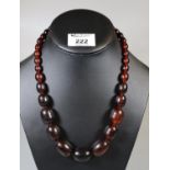 Graduated string of vintage brown beads. (B.P. 21% + VAT)