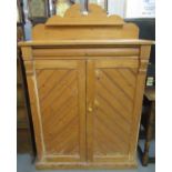 Rustic pine two-door blind panel free standing cupboard, the interior revealing fitted shelves on
