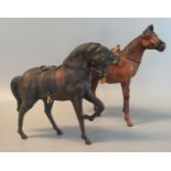 Two leather horses with naturalistic features, saddles and reins, longest 37cm approx. (B.P. 21% +
