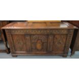 Titchmarsh & Goodwin, good quality oak coffer, the moulded and hinged lid above carved frieze with