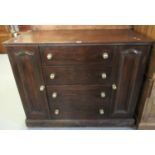 Early 20th century oak chest/sideboard with an arrangement of four straight front drawers flanked by