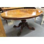 Victorian walnut loo table of oval form, the moulded top above a good quality carved foliate