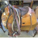 Good quality leather Western horse saddle with girth, stirrups, saddle cloth, bridle, etc. By Ray