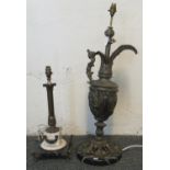 Yellow metal lamp base in the form of an ewer jug with figural handle on a moulded foliate and