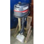 Yamaha 5 horse power petrol outboard motor appearing in virtually unused condition, on home made