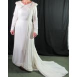 Vintage, possibly 1950s, winter wedding dress in white velvet with faux fur lined collar and fur