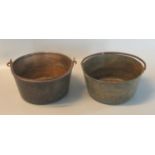 Two similar traditional brass preserving pans with iron swing handles. (2) (B.P. 21% + VAT)