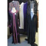 Nine vintage dresses to include: a black satin dressing gown with white lace, a Rapp viscose crushed