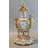 Reproduction French design gilt metal and porcelain two-train balloon-shaped mantel clock. 42cm high