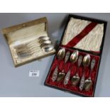 Cased set of six continental silver spoons with filigree handles marked 800, 2.75oz troy. Together