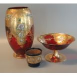 Two ruby glass items to include comport and baluster vase overall with gilded and floral decoration,