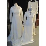 Three vintage empire line wedding dresses: one, white net with lace and appliqued daisies around