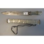 Middle Eastern white metal repousse mounted dagger and scabbard, having clipped fullered blade and