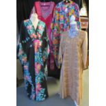 Four vintage kaftans: a Shivani silk kaftan intricately decorated with fawn and green embroidery,