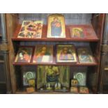 Collection of assorted Orthodox Christian religious icons of various sizes and forms, some