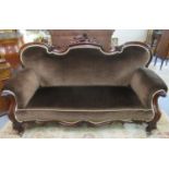 Victorian mahogany double ended show frame sofa , the shaped and carved back with scroll arms with