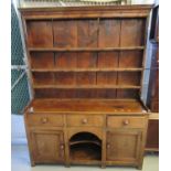 19th century Welsh oak two-stage rack-back dog kennel dresser, the moulded cornice above boarded