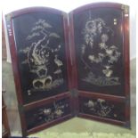 Japanese lacquered two fold arches screen, decorated with inlaid mother of pearl and painted