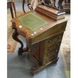 Victorian walnut Davenport desk of serpentine form having shaped moulded supports with four