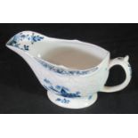 18th century Lowestoft porcelain sauce boat, decorated in underglaze blue, floral relief moulded