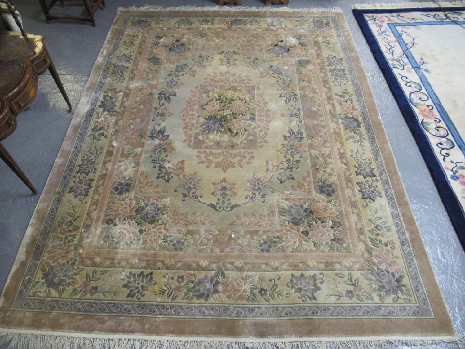 Large Chinese cream ground foliate carpet with central oval-shaped foliate medallion. 369 x 276cm