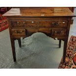 Early 19th century oak lowboy, the moulded top above and arrangement of one long and two short