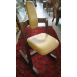 Peter Opsvik beech framed pendulum rocking chair, with leather head rest and seat. Manufactured