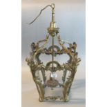 Brass rococo style hall lantern of tapering form with sea scroll and foliate decoration. Modern.