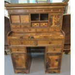 Unusual Japanese design knee hole desk of small proportions, the moulded cornice above an