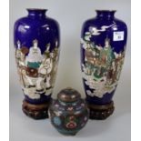 Pair of good quality Japanese Cloisonne vases on wooden stands, depicting legendary Buddhist