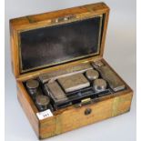 Mid Victorian silver and glass travelling vanity set, the oak and brass banded box revealing