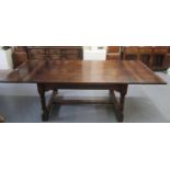 17th century style oak extending refectory type table, the four plank moulded top above shaped