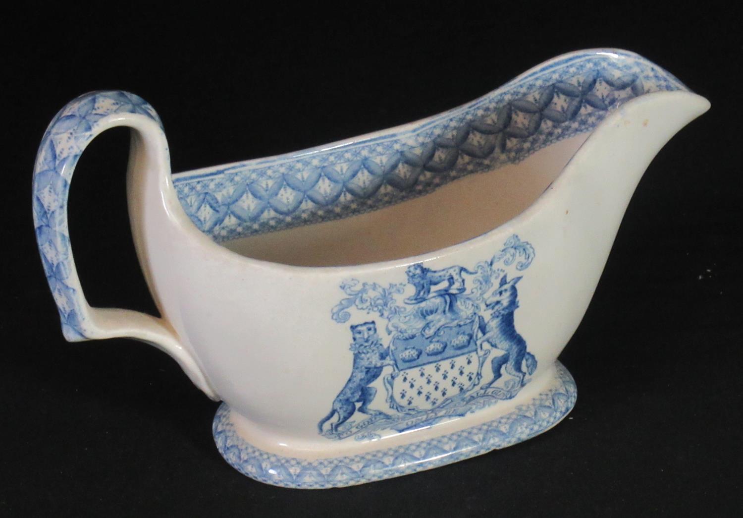 Spode china blue and white transfer printed sauce boat with armorial decoration, Skinner &