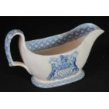 Spode china blue and white transfer printed sauce boat with armorial decoration, Skinner &