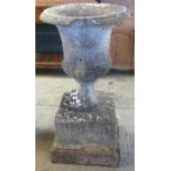 Reconstituted stone Campana shaped garden urn on square fluted base. 54cm diameter, 103cm high