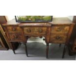 William IIII mahogany breakfront sideboard with central drawer over scrolled arch flanked by an