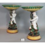 Pair of 19th century Wedgwood majolica comports, the pierced basket with weave design above a