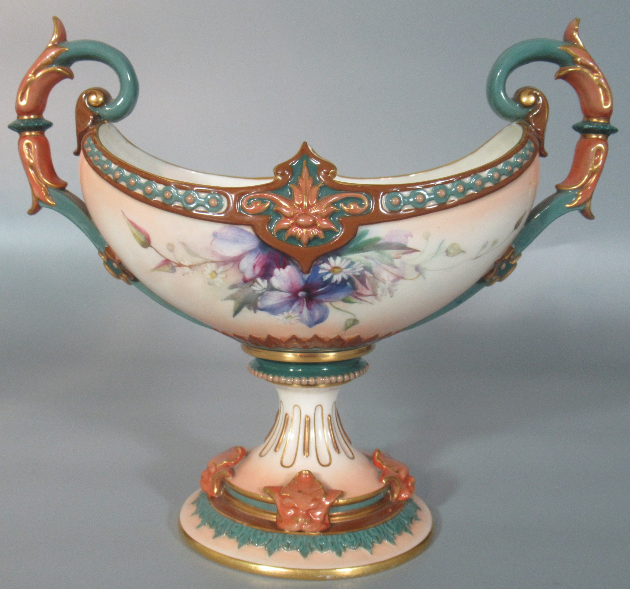 Early 20th century Hadley Worcester boat shaped two-handled vase, hand painted with clematis above a