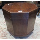 19th century mahogany inlaid hexagonal cellarette of small plain form, the hinged lids revealing