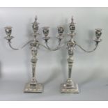 Pair of Adams style silver plated three-branch table candelabra decorated with swags and trailing