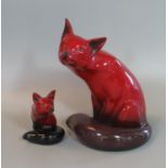 Royal Doulton flambe seated fox, together with a Royal Doulton flambe fox cub. (2) (B.P. 21% +