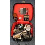Small suitcase of assorted jewellery to include various silver, silver bowling badge, costume