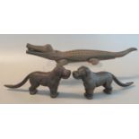 Three cast iron novelty nut crackers in the form of a crocodile and a pair of dogs. (3) (B.P.